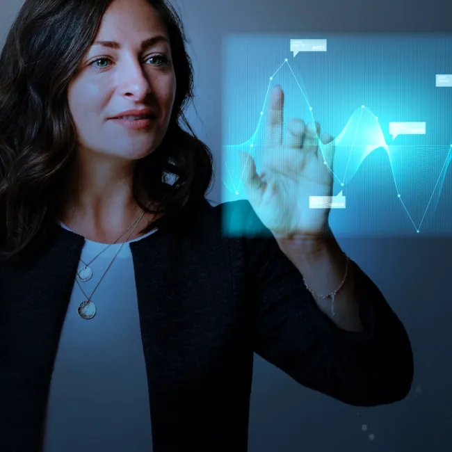 Professionaly dressed female using a touch screen